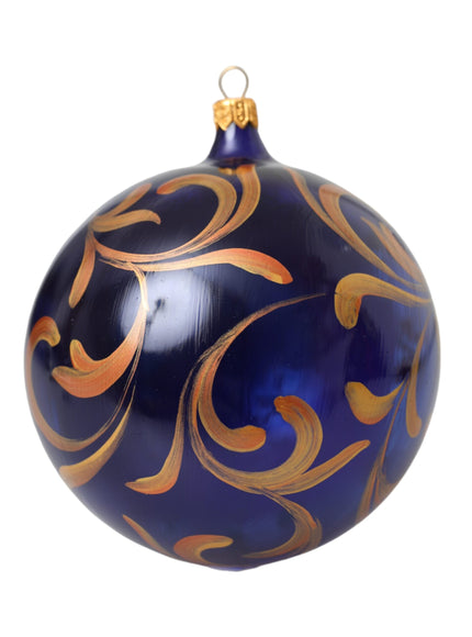 a blue ornament with gold swirls on it