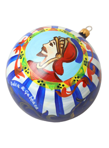 a round ornament with a painting of a clown on it