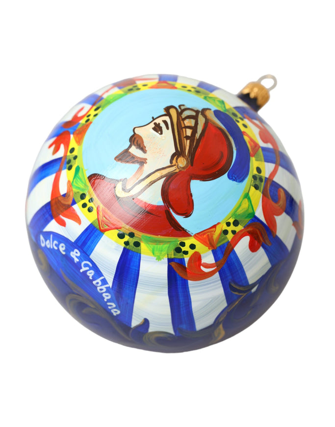 a round ornament with a painting of a clown on it