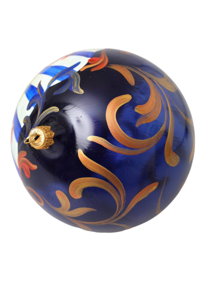 a blue ornament with gold designs on it