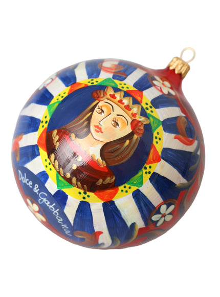 a glass ornament with a woman's face painted on it