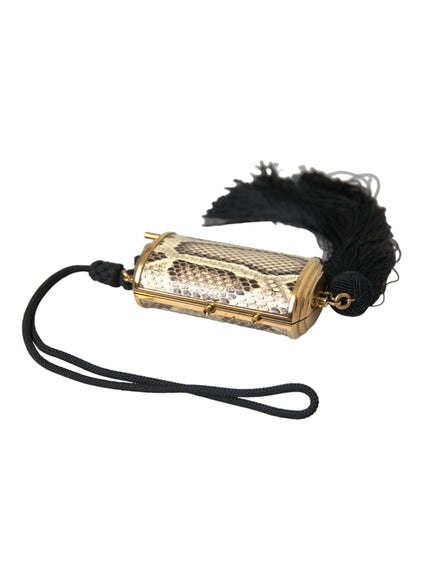 a gold case with a black feather on it