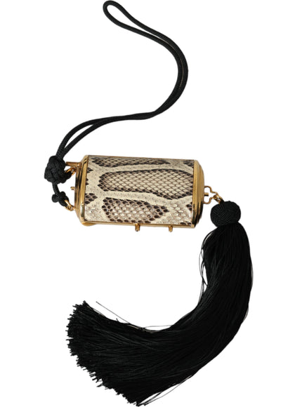 a snake skin purse with a tassel