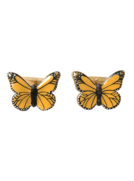 a pair of yellow and black butterfly earrings