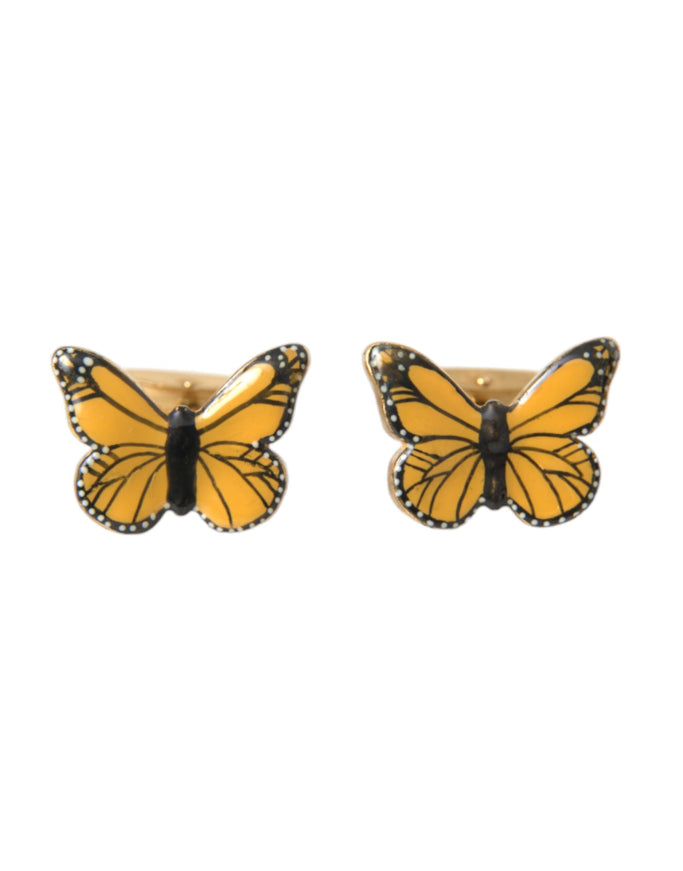 a pair of yellow and black butterfly earrings