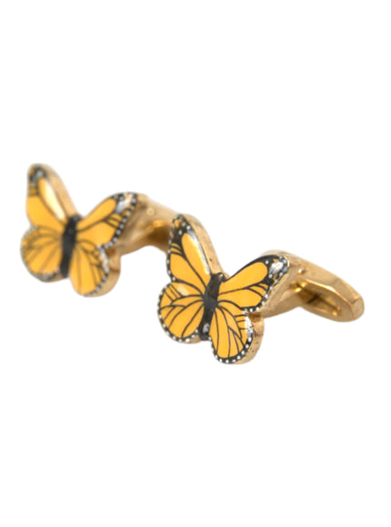 a pair of yellow butterflies sitting on top of each other