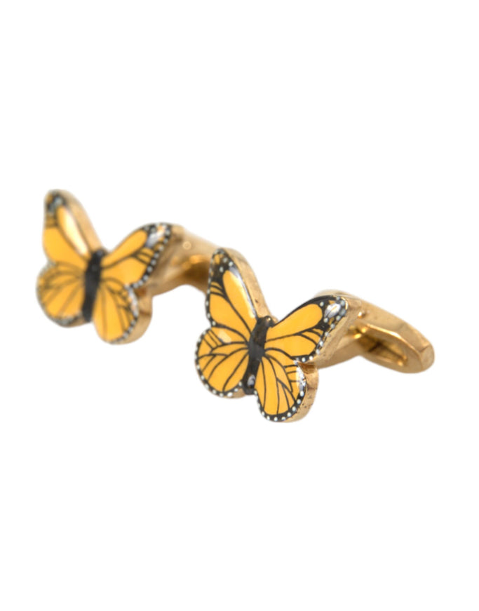 a pair of yellow butterflies sitting on top of each other