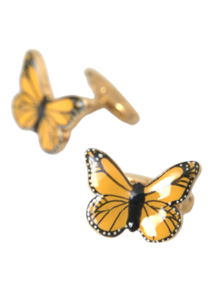 a pair of yellow and black butterflies on a white background