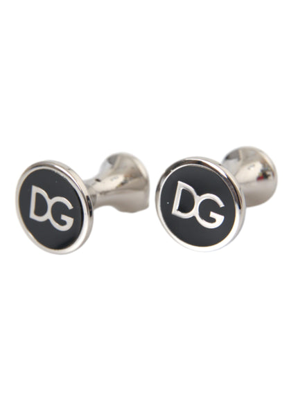 a pair of black and silver cufflinks with the letter dg on them