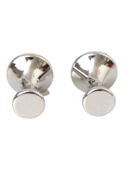 a pair of silver earrings with a round design