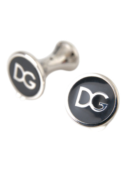 a pair of black and silver cufflinks with the letter d on them