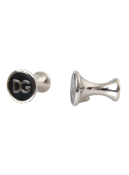 a pair of cufflinks with the letter g on them