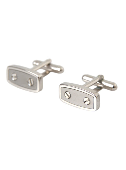 a pair of silver cufflinks on a white background