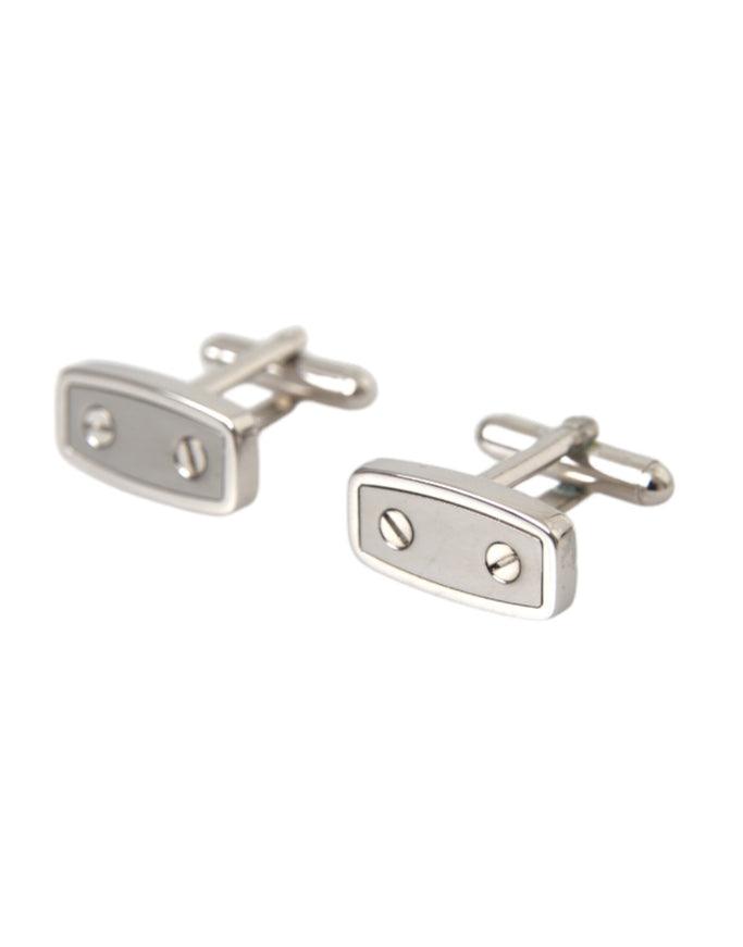 a pair of silver cufflinks on a white background