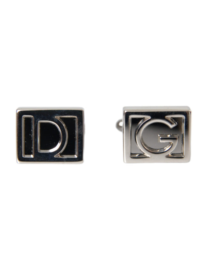 a pair of cufflinks with the letter g on them