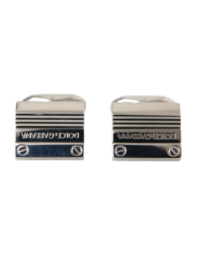 a pair of silver cufflinks with a black and white stripe