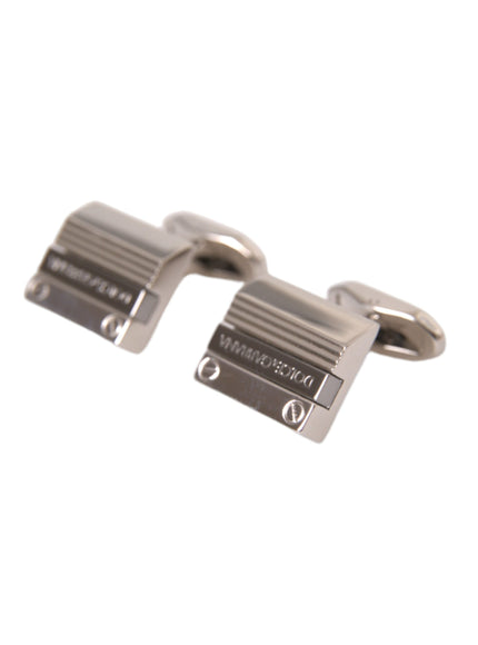 a pair of silver cufflinks on a white background