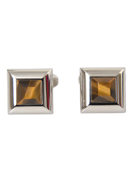 a pair of cufflinks with a square shaped stone