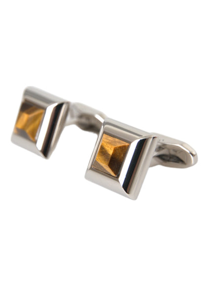 a pair of silver and gold cufflinks