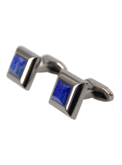 a pair of silver cufflinks with blue stones