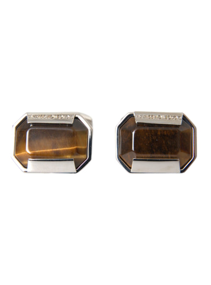 a pair of tiger's eye cufflinks on a white background