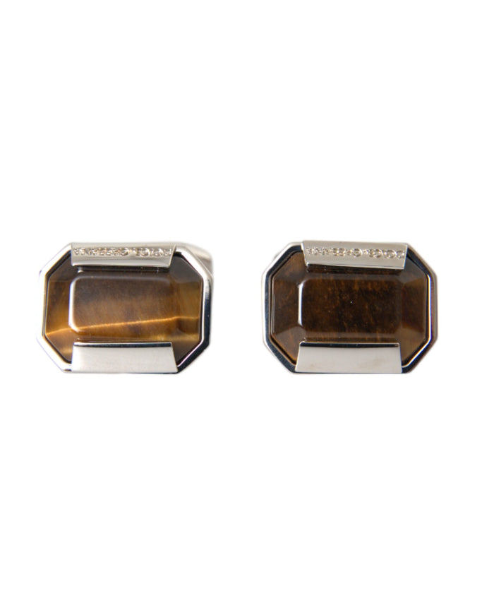 a pair of tiger's eye cufflinks on a white background