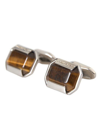 a pair of cufflinks with tiger's eye