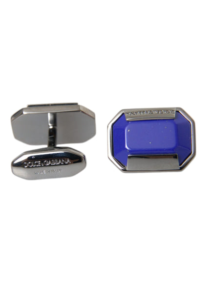 a pair of blue and silver cufflinks