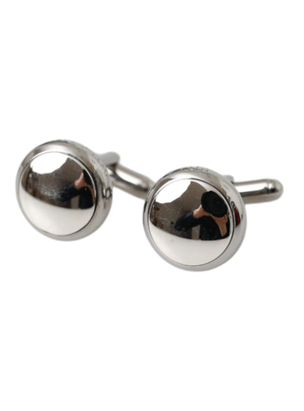 a pair of silver cufflinks with a round design