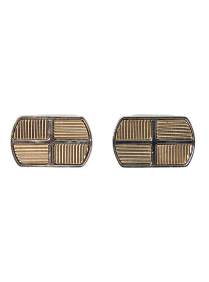 a pair of silver and gold cufflinks