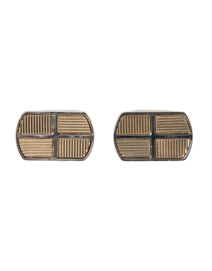 a pair of silver and gold cufflinks