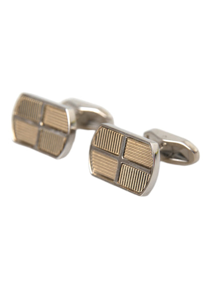 a close up of a pair of cufflinks