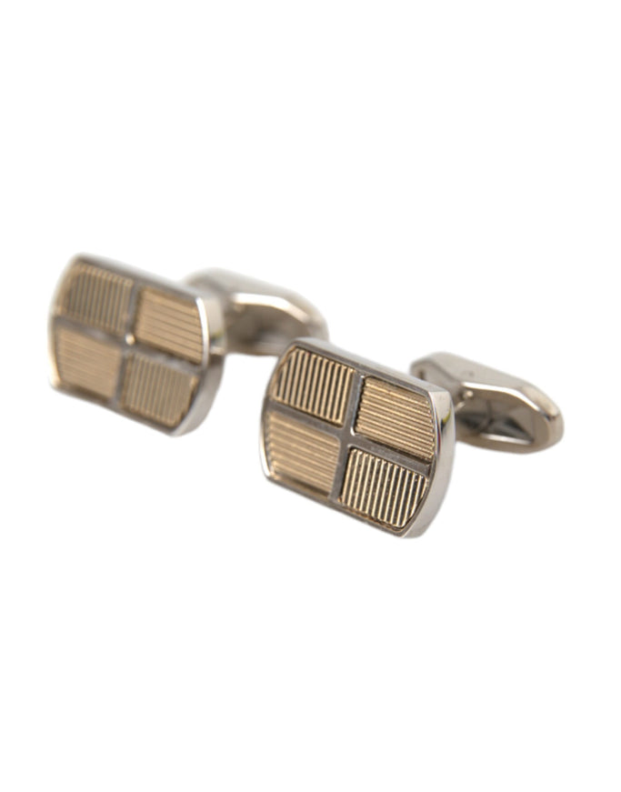 a close up of a pair of cufflinks