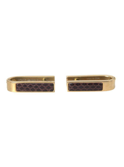 a pair of gold and brown cufflinks