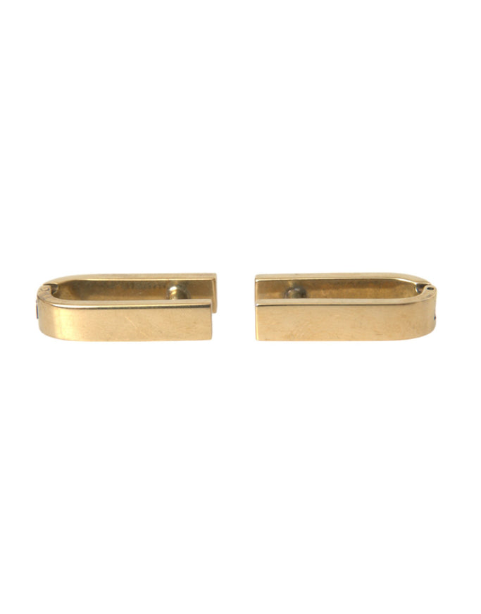 a pair of yellow gold earrings on a white background