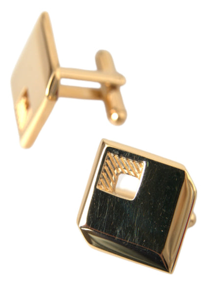 Angled view of gold square pin cufflinks