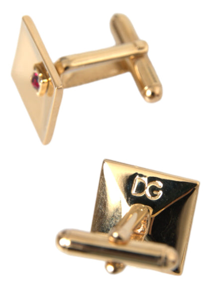 Close-up of Dolce & Gabbana gold cufflinks with DG engraving