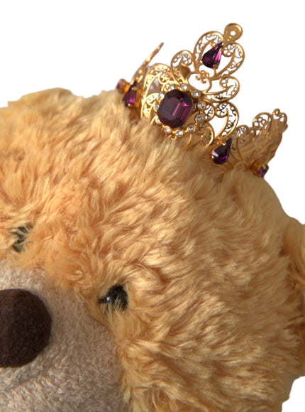 Close-up of gold crystal crown on teddy bear hair band