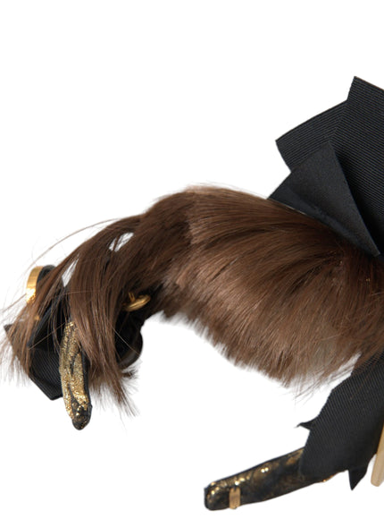 Detail of Dolce & Gabbana headband with brown hair and black bow