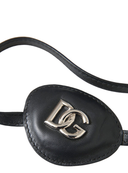 Close-up of Dolce & Gabbana DG logo on black leather eye patch