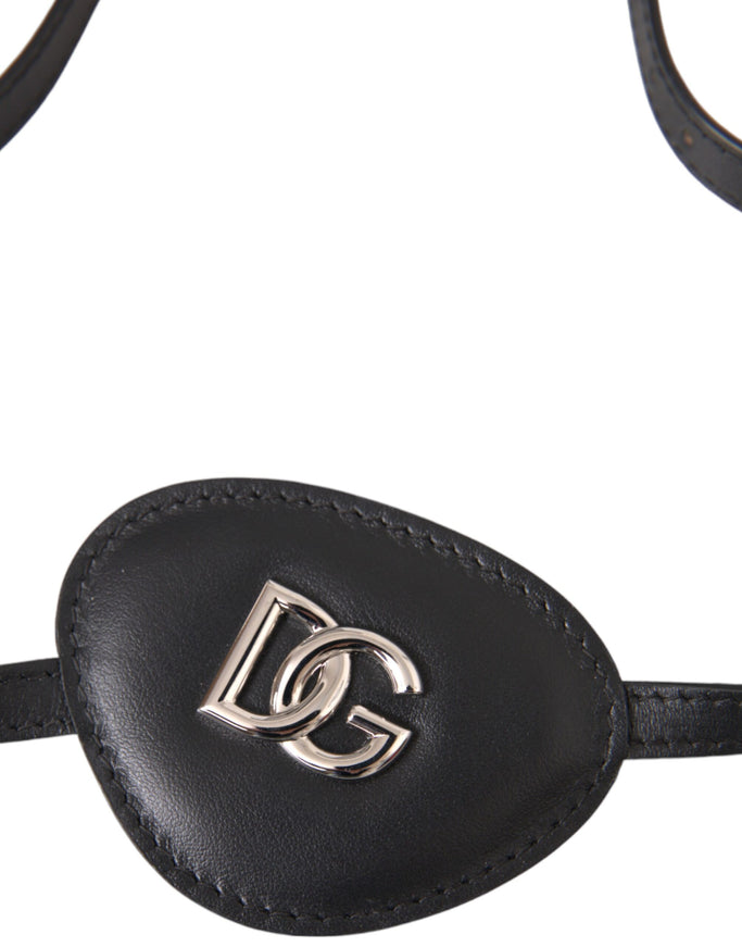 Close-up of DG logo on black leather eye patch