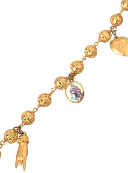 Detailed view of necklace with gold beads and charms