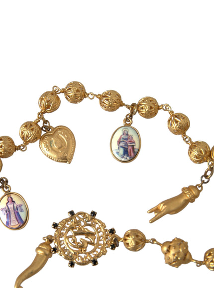 Gold chain necklace featuring charms and ornate beads