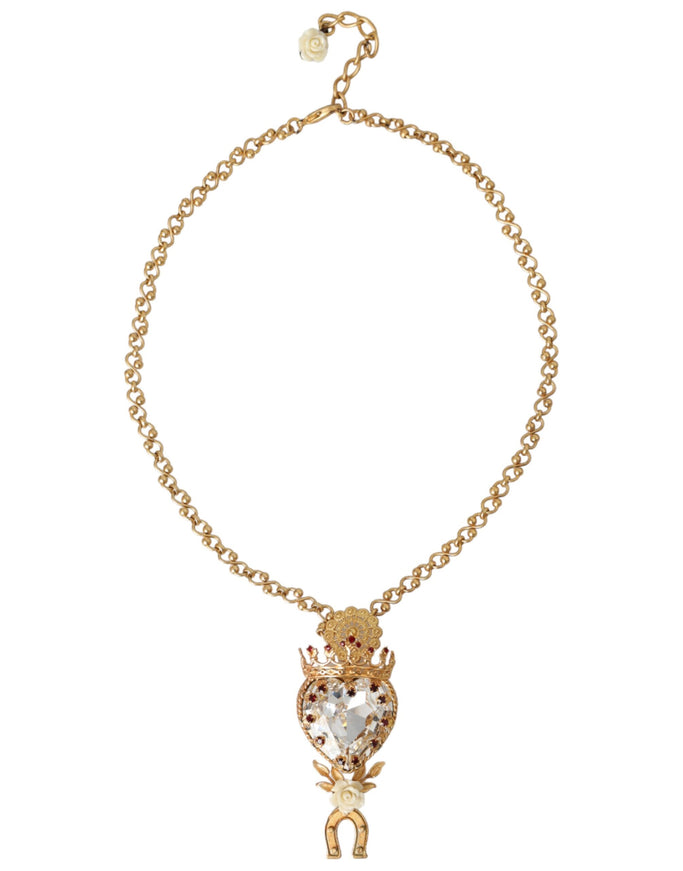 Close-up of crystal heart charm on gold brass chain necklace