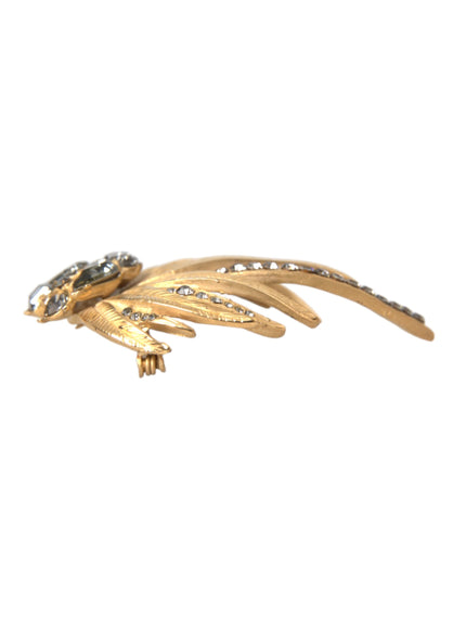 Side view of gold brass leaf brooch with crystals