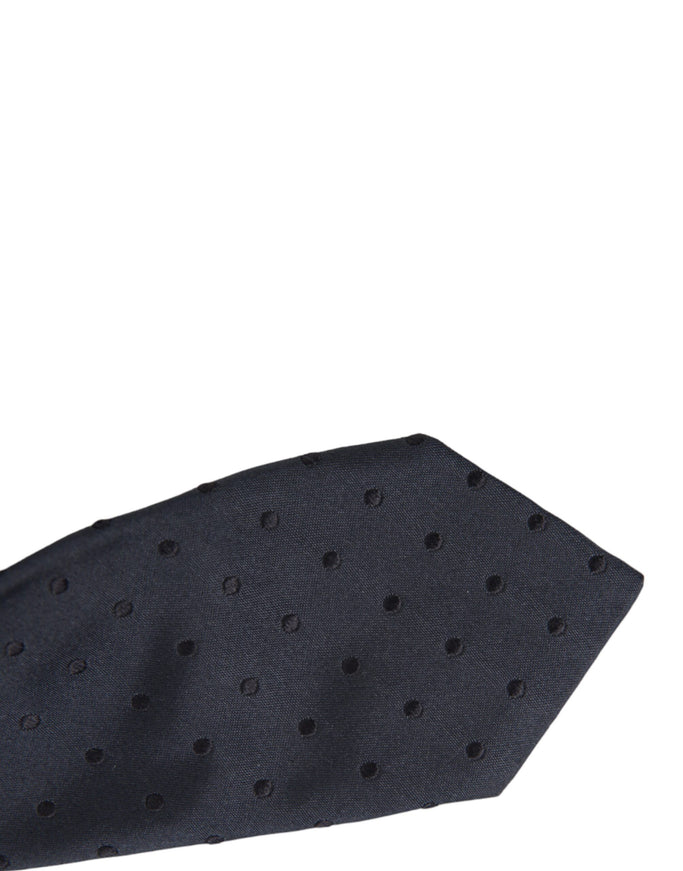 Close-up of dark blue dotted silk tie tip