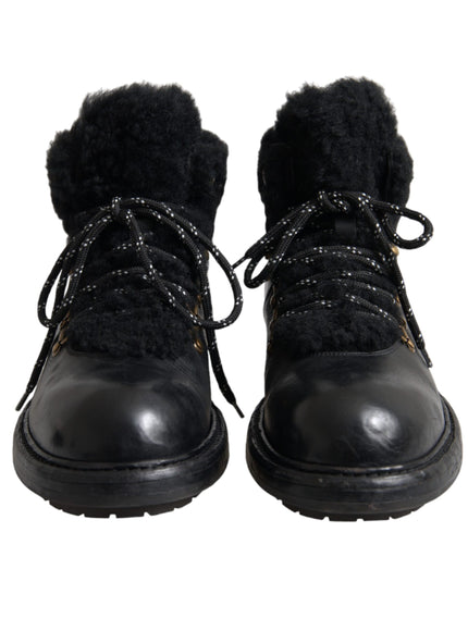 Front view of Dolce & Gabbana black leather shearling boots