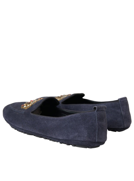 Back view of blue leather loafers with crown embroidery