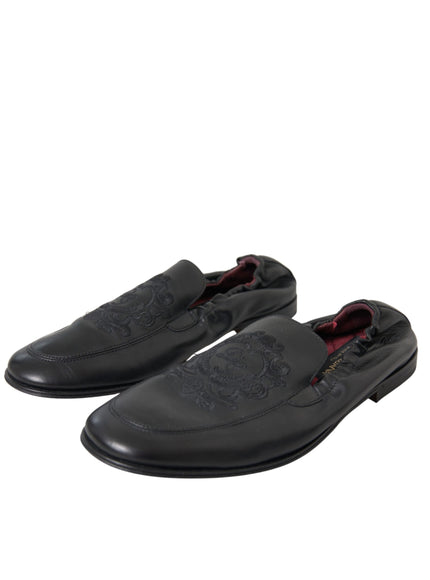 Angled view of Dolce & Gabbana black leather loafers