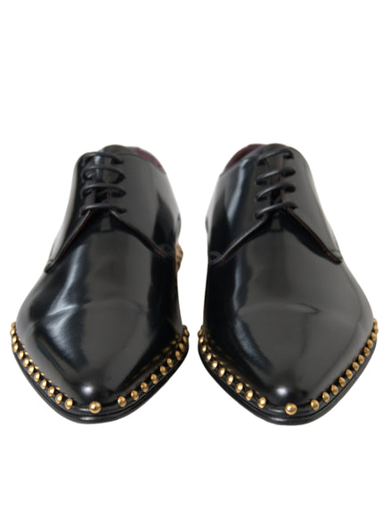 Front view of Dolce & Gabbana black leather shoes with gold studs